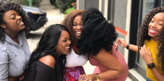 Image: A group of women laughing together