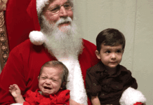 A brother and sister visiting Santa Claus for the first time