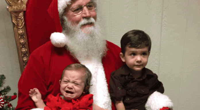 Image: A brother and sister visiting Santa Claus for the first time