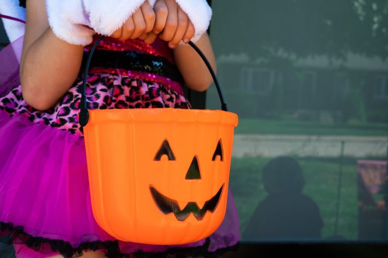 girl candy bucket Sugar & Cavity Prevention: Ask Dr. Bob About Halloween Candy Lynda Lantz Contributor Miami Moms Blog