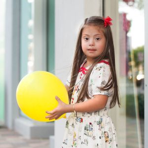 Mia and a yellow balloon Janeris Marte Contributor Miami Moms Blog
