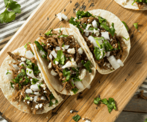 Image: Fresh homemade tacos on a wooden cutting board