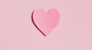 A pink paper heart (More Self-Love in 2021: 7 Ways to Love Ourselves Daily Rachelle Haime Contributor Miami Mom Collective)