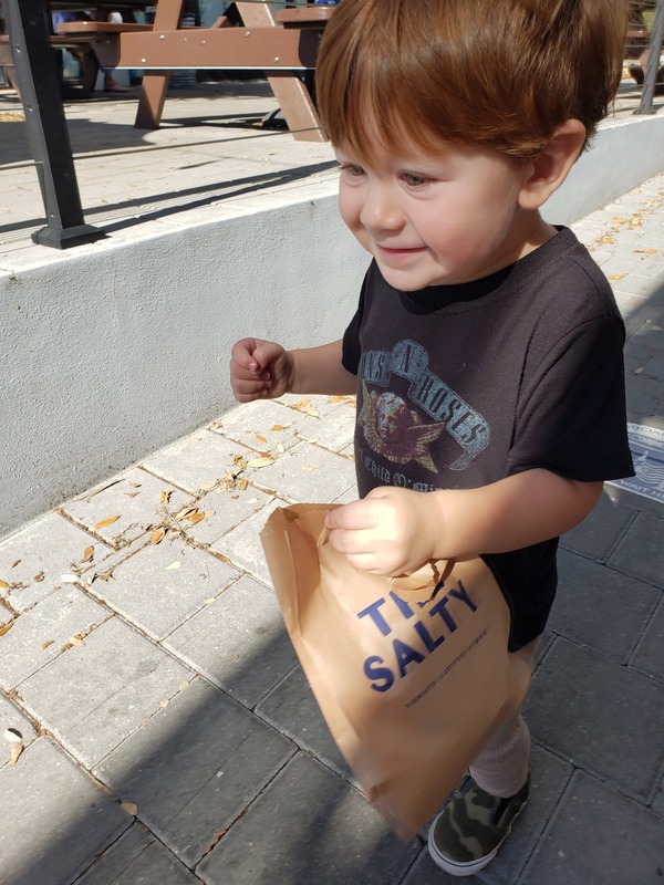 Marcelo with a treat from The Salty (Raising Vegan Kids: Where and What to Eat on the Go Sandra Jacquemin Contributor Miami Mom Collective)