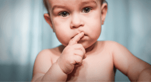 Image: A baby with a skeptical expression (I’m a Dietitian, and I Hated Feeding My Baby Solid Food (At First) | Part 1 Monica Auslander Moreno Contributor Miami Mom Collective)