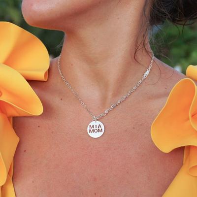 A woman wearing an MIA Mom necklace from Emme (Small Business: How to Help Mom and Pop Shops During Covid Minerva Roca Contributor Miami Mom Collective)