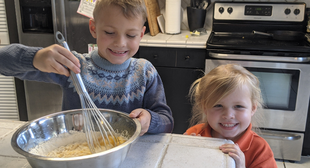 My kids helping to make the batter (International Waffle Day: Like Music to My Ears Rachel Hulsund Contributor Miami Mom Collective)