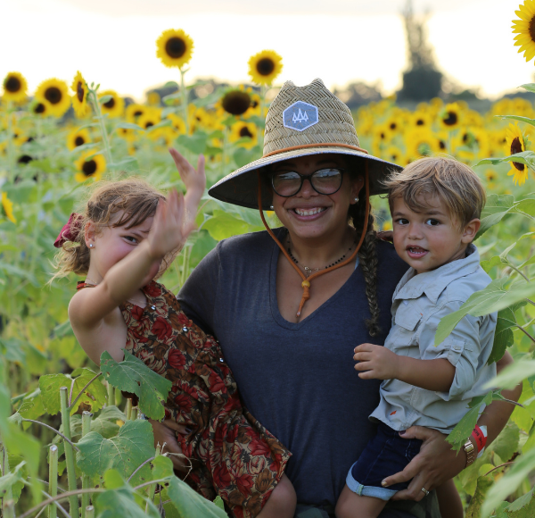 Dianna and her kids in the sunflower fields (Dianna Hill Contributor Miami Mom Collective)
