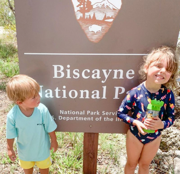 Dianna's kids in front of a sign for Biscayne National Park (Love Where You Live: Why I Love Living in Cutler Bay Dianna Hill Contributor Miami Mom Collective)