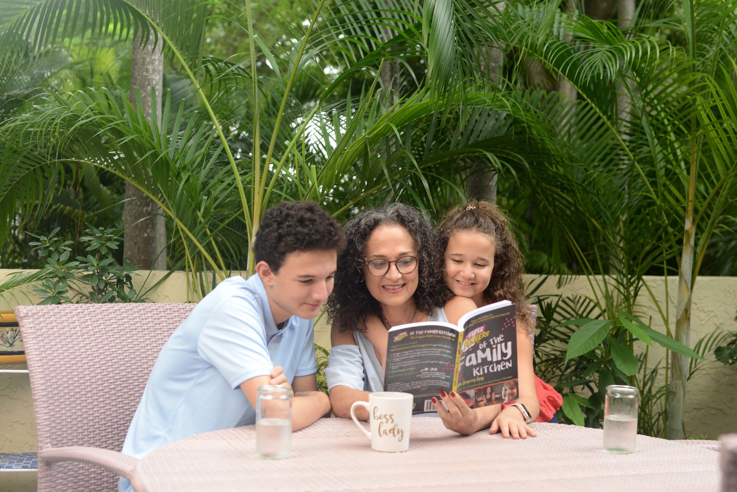 Adita reading with her kids (Parenting: The Ups, Downs, and All the Way Arounds Adita Lang Contributor Miami Mom Collective)