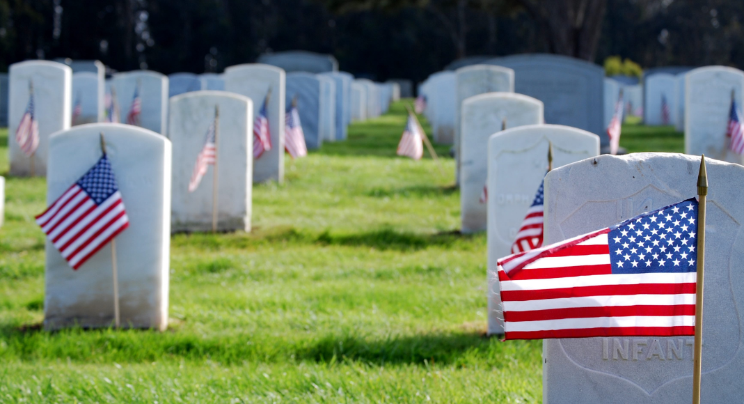 American flags in a cemetery (Memorial Day: Making It Memorable for the Whole Family Rachel Hulsund Contributor Miami Mom Collective)
