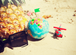 Sunglasses, a pineapple, a toy airplane, and a globe (Fighting Summer Boredom Lorena Lougedo Contributor Miami Mom Collective)