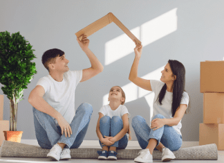 Image: A father and mother sitting on the floor with their daughter, surrounded by moving boxes (Moving with Children: 4 Helpful Tips Jessica Socarras Contributor Miami Mom Collective)
