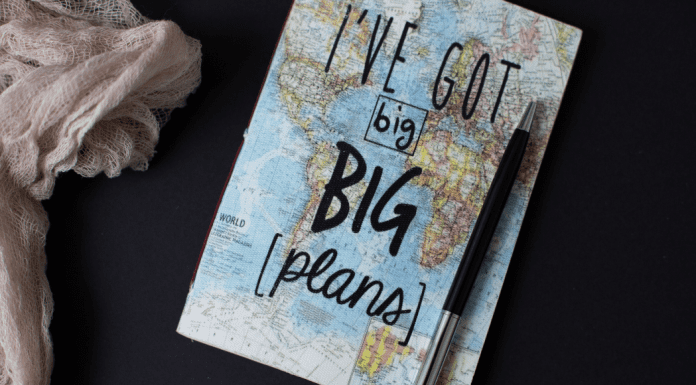 A map of the world and a pen (Summer Road Trips: Adventure Awaits You This Summer Jessica Alvarez-Ducos Contributor Miami Mom Collective)