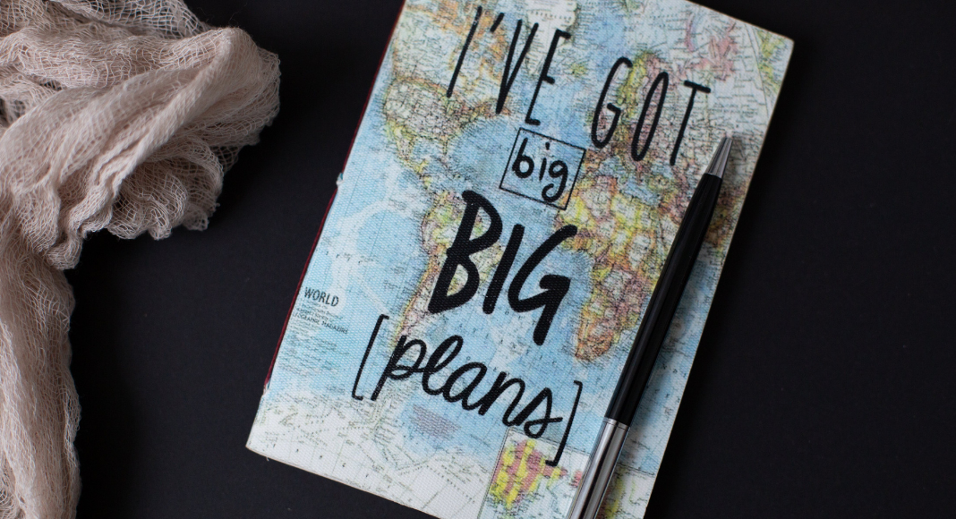 A map of the world and a pen (Summer Road Trips: Adventure Awaits You This Summer Jessica Alvarez-Ducos Contributor Miami Mom Collective)