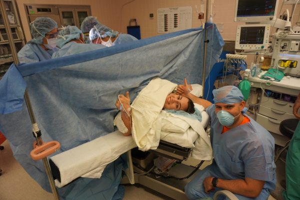 A mom and dad in the OR for a C-section (C-Section Recovery: Taking Care of Yourself So You Can Care For Baby! Alexa Gonzalez Contributor Miami Mom Collective)