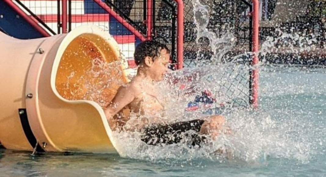 Going down a water slide (Summer Is Almost Here! Are You Ready? | Dr. Bob Pediatric Dentist Lynda Lantz Contributor Miami Mom Collective)