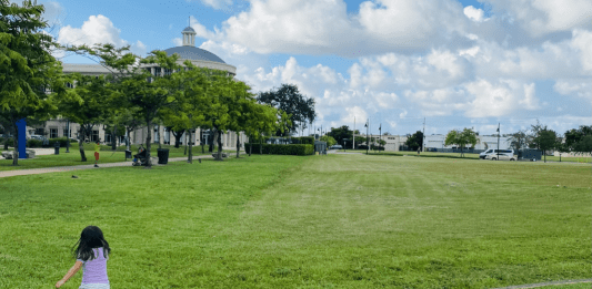 Valerie's daughter running in an open green space (Love Where You Live: Why I Love Living in Doral Valerie Barbosa Contributor Miami Mom Collective)
