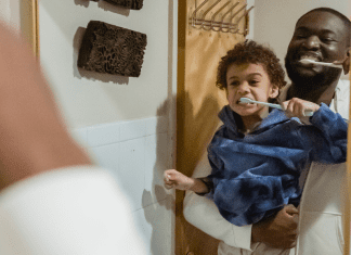 A father and son brushing their teeth (Favorite Things: Dr. Bob's Top 6 Dental Products for Kids Lynda Lantz Contributor Miami Mom Collective)
