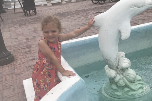 Lorena's daughter admiring a fountain at Marco Island Plaza (Lorena Lougedo Contributor Miami Mom Collective)