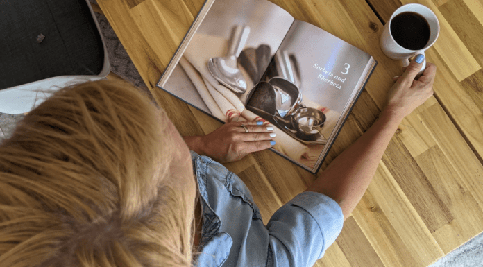 A woman looking at a book about ice cream (July is National Ice Cream Month: Give Me all the Sweetness! Rachel Hulsund Contributor Miami Mom Collective)