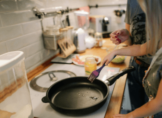 A mom and daughter cooking together in the kitchen (Summer Fun that Leads to Lasting NEW Habits for the Entire Family Adita Lang Contributor Miami Mom Collective)
