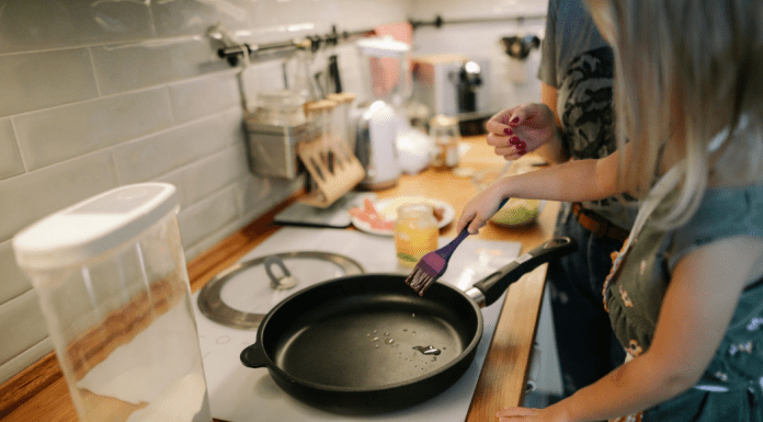 A mom and daughter cooking together in the kitchen (Summer Fun that Leads to Lasting NEW Habits for the Entire Family Adita Lang Contributor Miami Mom Collective)