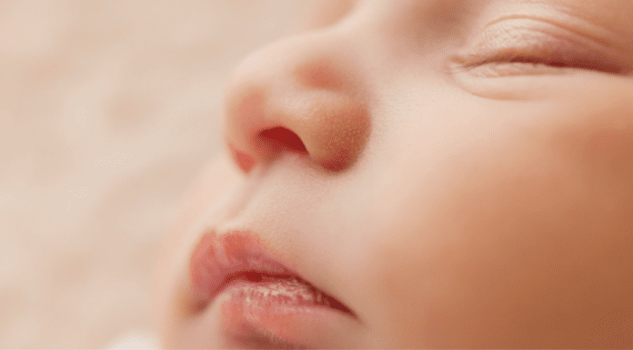 A picture of a sleeping baby's face (Baby Safety Month: Helpful Tips for Keeping Your Little One Safe Dianna Hill Contributor Miami Mom Collective)