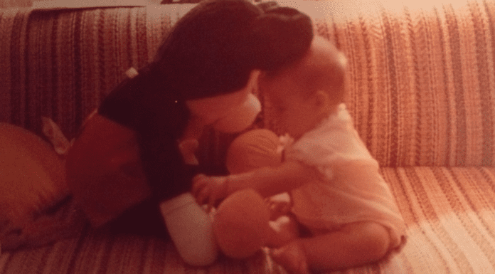A picture of Sandra as an infant with her first Mickey toy (Disney Has Some Secrets, Sort Of Sandra Jacquemin Contributor Miami Mom Collective)