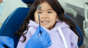 Image: A young girl at the dentist's office