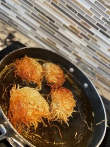 Image: A pan of latkes on the stove