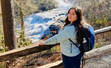 MMC Contributor Rachel Santos at a waterfall in Asheville, NC