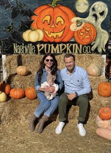 Morgan poses for a photo with her husband and daughter at Nashville Pumpkin Co.