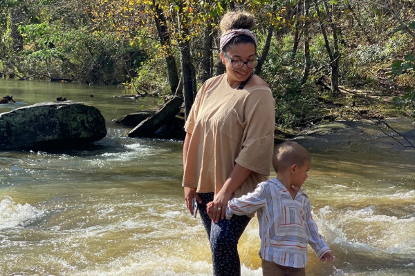 Image: Dianna and her son standing by a stream in North Carolina (Dianna Hill Contributor Miami Mom Collective)