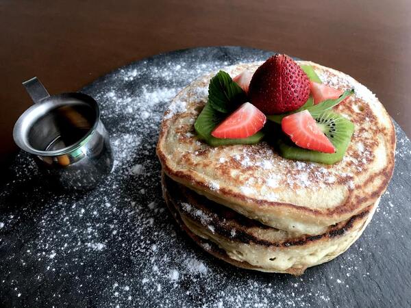 Image: A stack of vegan pancakes topped with fresh fruit (Going Vegan: It's Not As Difficult As You Think Sandra Jacquemin Contributor Miami Mom Collective)