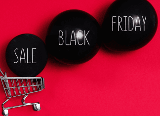 Image: A shopping cart and black balloons that read "Sale Black Friday" (Black Friday Deals: 5 Ways to Make the Most of Them Ana-Sofia DuLaney Contributor Miami Mom Collective)