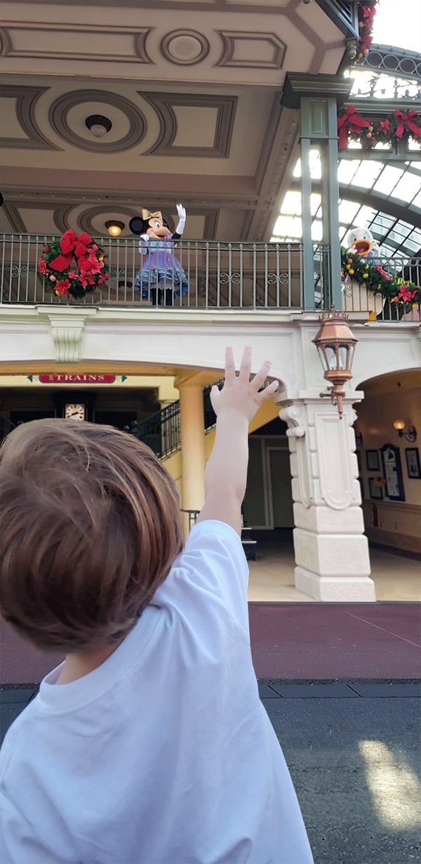 Image: Sandra's son waiving at Minnie Mouse (Sandra Jacquemin Contributor Miami Mom Collective)