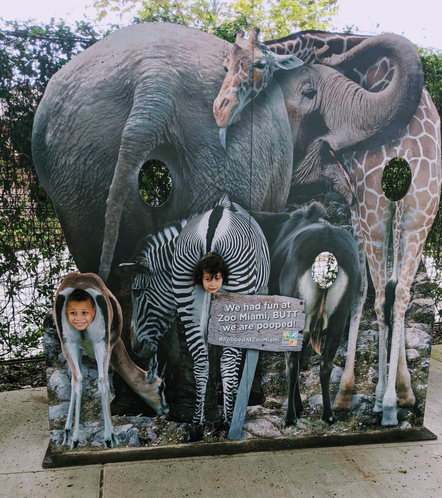 Image: Two kids posing for a picture at Zoo Miami (Winter Break Bucket List: Have Fun & Make Lasting Memories | Dr. Bob Lynda Lantz Editor Miami Mom Collective)