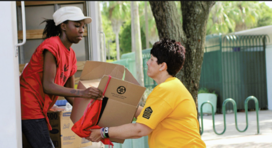 Image: Volunteers collecting items for families in need (Christmas: An Awesome Opportunity to Volunteer as a Family Holly Farver Contributor Miami Mom Collective)