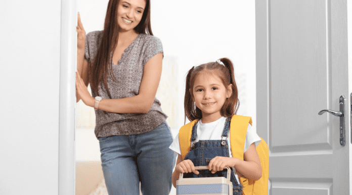 Image: A mom looks on as her daughter walks out the door, ready for school (School Mornings: 11 Hacks to Make Them Easy (Ok, "Easier") Candice Carricarte Contributor Miami Mom Collective)