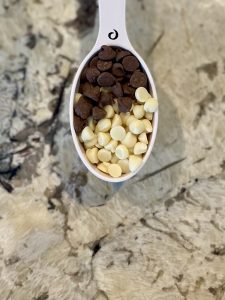A spoonful of milk chocolate and white chocolate chips (GF Instant Pot Soufflake: The Not-So-Lava Cake Rachelle Haime Contributor Miami Mom Collective)