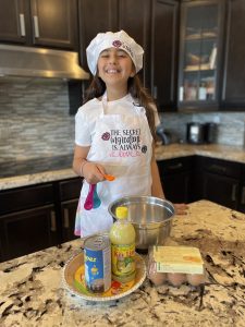 Rachelle's daughter displaying the ingredients for coconut key lime pie