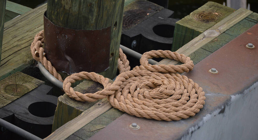Rope on a dock wrapped in the shape of Mickey Mouse
