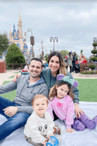Family picnicking infrot of Cinderella's castle