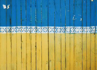 A fence painted like the Ukrainian flag in Kyiv, Ukraine
