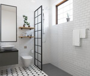 A modern bathroom with a black and white tile floor
