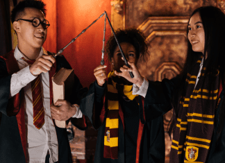 Three children dressed in Harry Potter costumes