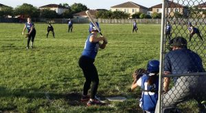 Natasha's daughter playing softball