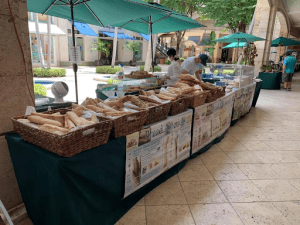 A display of artisanal breads at the farmers' market in Coral Gables