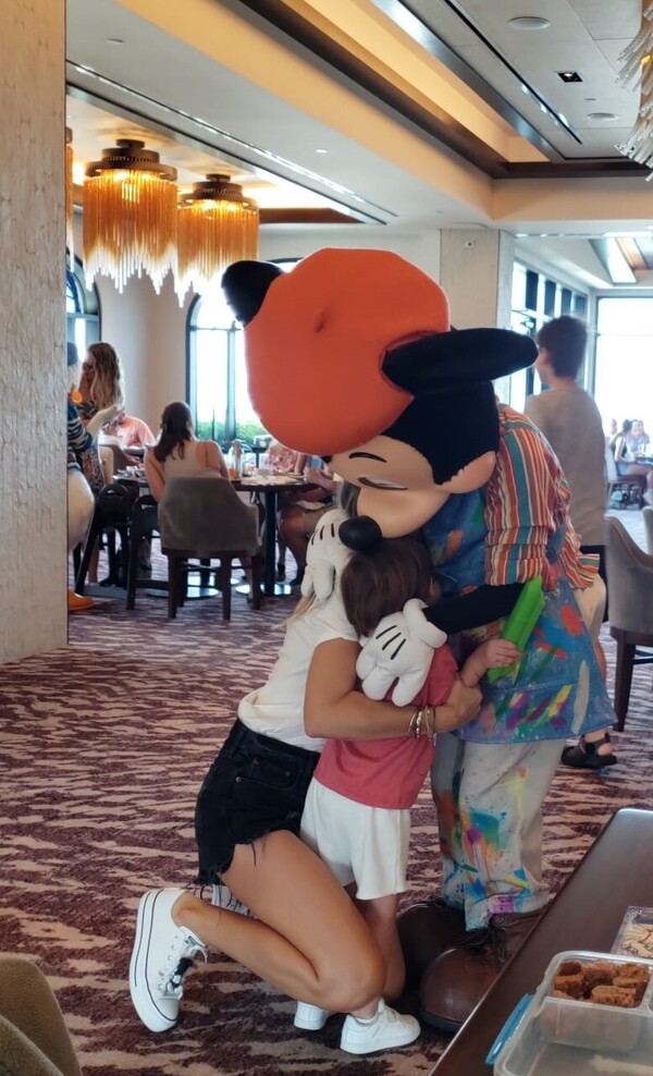 Mickey Mouse giving hugs at Disney World